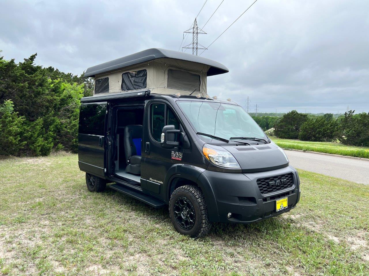 Black 2023 Ram ProMaster 1500 with Penthouse top.