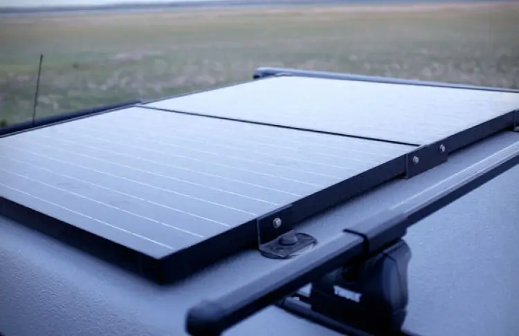 Solar panels installed on a roof of a converted van.