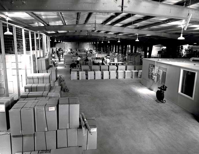 View from inside of Sportsmobile's factory. Employees working on van conversions. Picture from 1961.