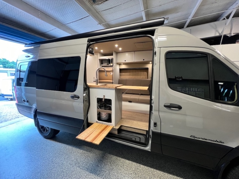 Interior of a grey van converted by Sportsmobile.